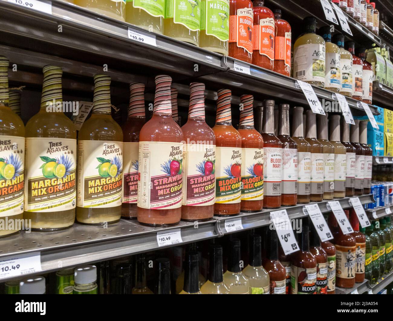 Lynnwood, WA USA - circa April 2022: Angled view of cocktail mixers, tonic water, and club soda for sale inside a Town and Country grocery store. Stock Photo