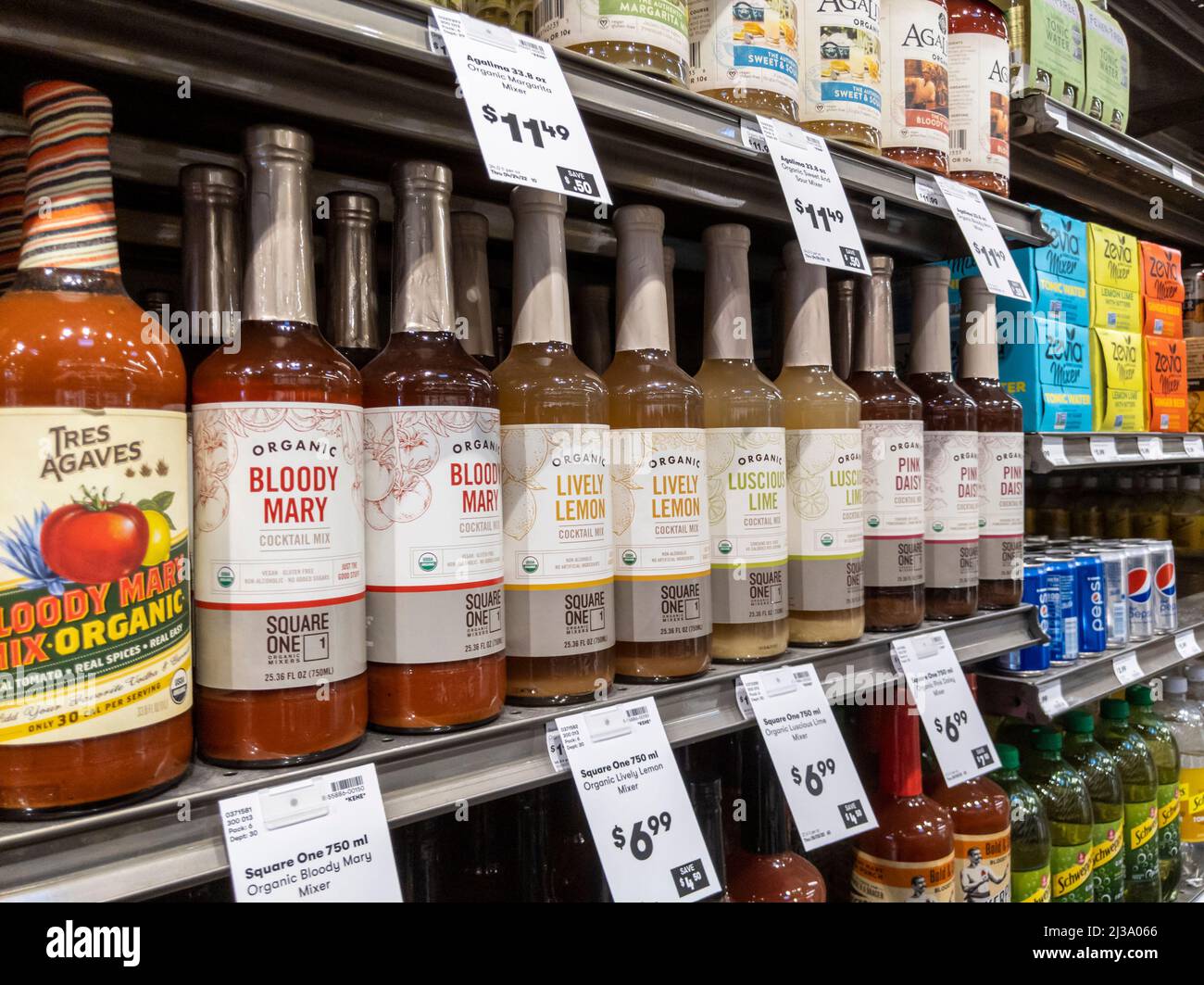 Lynnwood, WA USA - circa April 2022: Angled view of cocktail mixers, tonic water, and club soda for sale inside a Town and Country grocery store Stock Photo