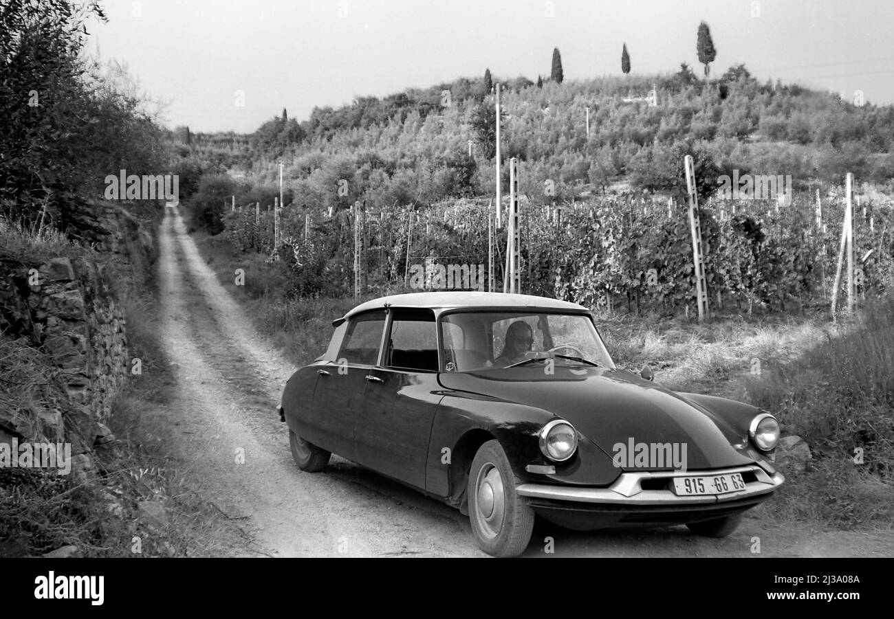 Classic Citroen car on country road in Tuscan region of Italy. Stock Photo