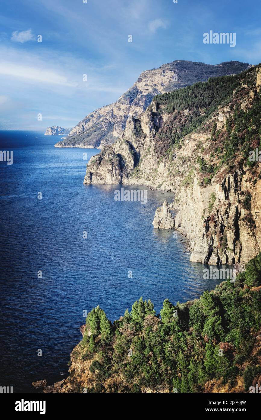 The rugged Amalfi coastline drops steeply to the Tyrrhenian Sea on the coast of Italy. Stock Photo
