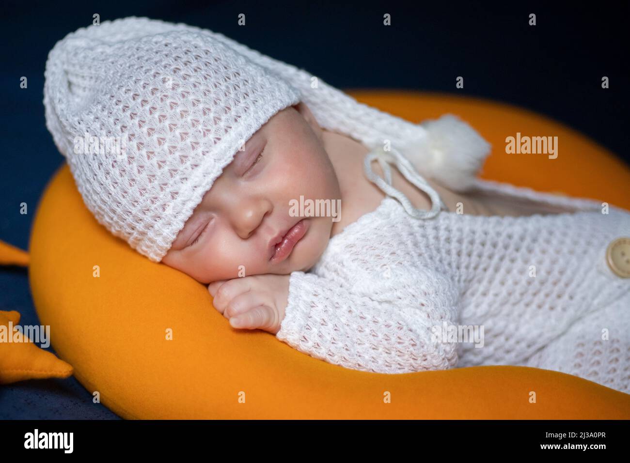 Baby Newborn Sleeping In Woolen Hat On White Wooden Background, Warm Winter Country  Style Stock Photo, Picture and Royalty Free Image. Image 27462458.
