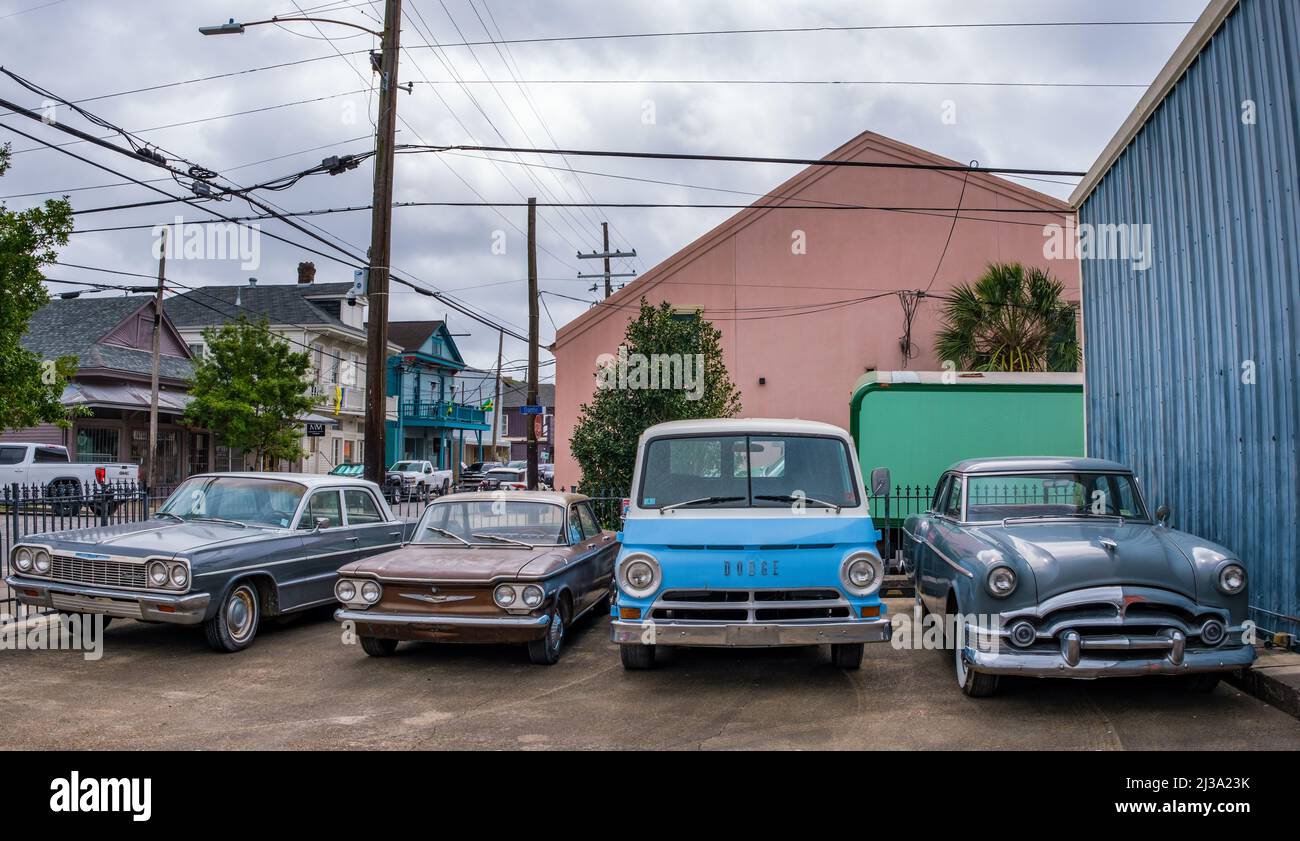 New Orleans, LA, USA - APRIL 5,  2022: Front view of four vintage cars in a parking lot on Oak Street Stock Photo
