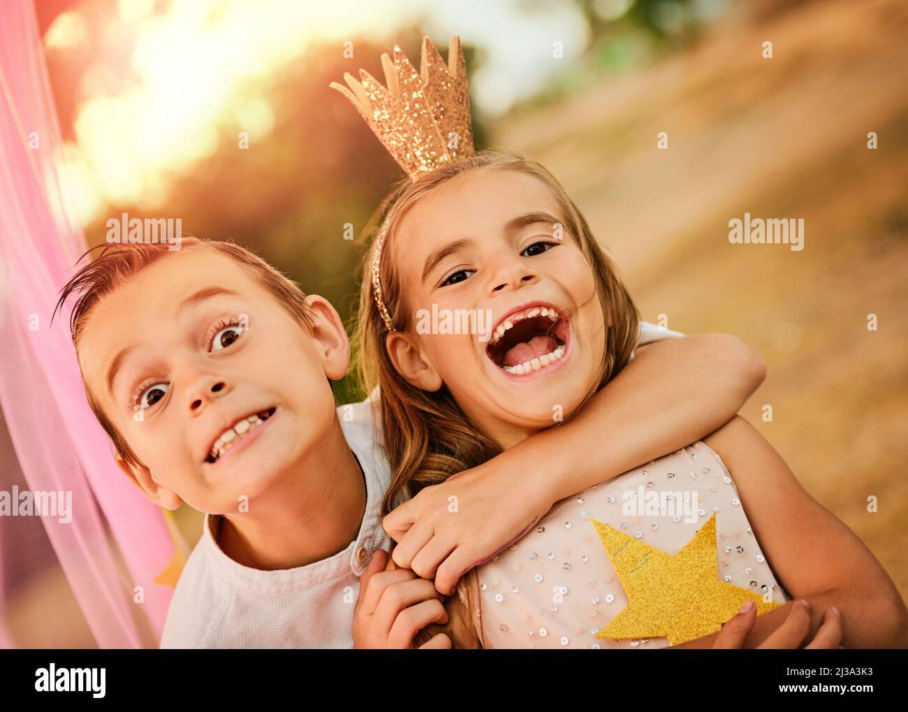 Enjoyment is spending time with your sibling. Shot of an adorable little brother and sister playing outdoors. Stock Photo