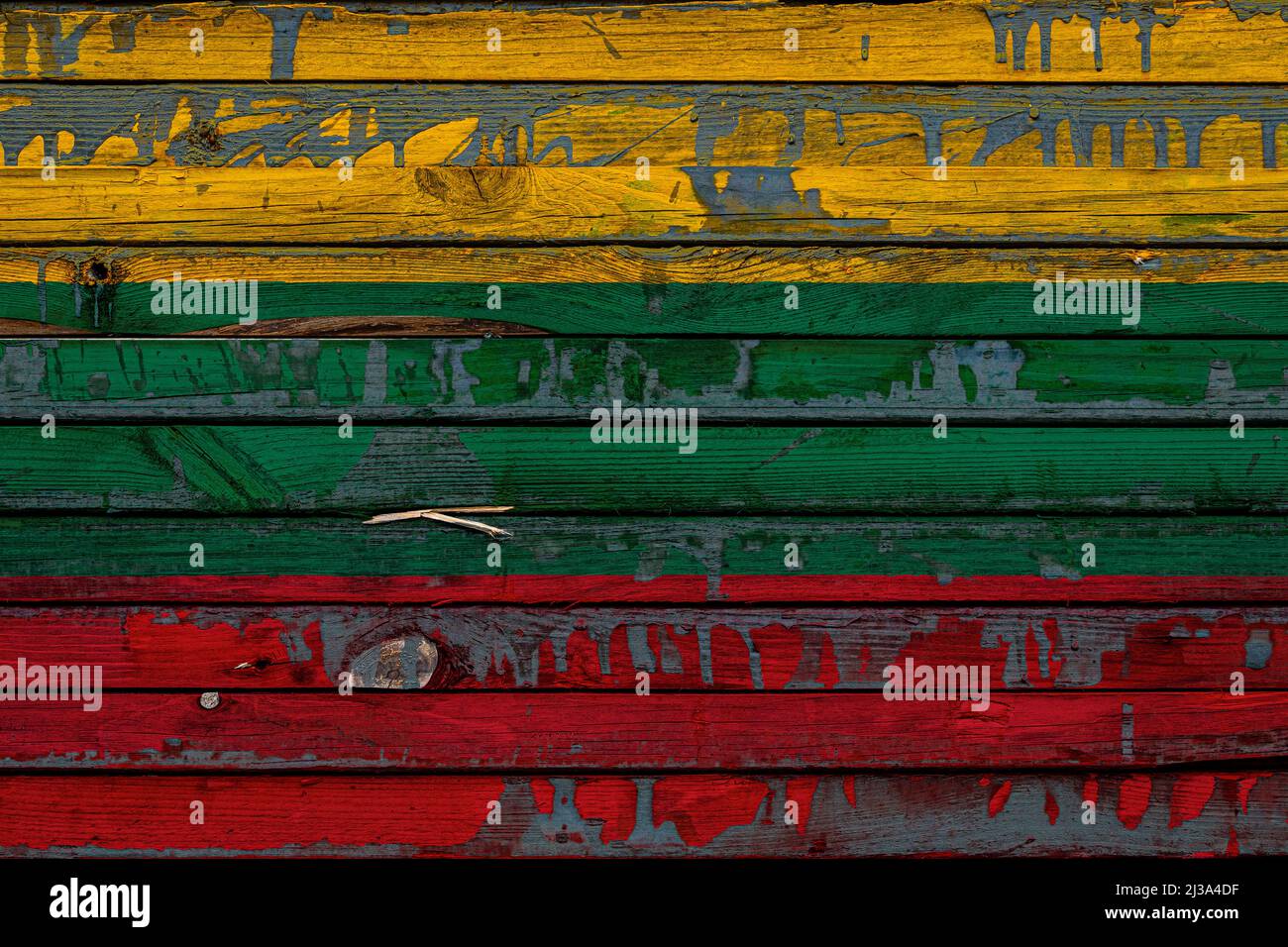 The national flag of Lithuania is painted on uneven boards. Country ...
