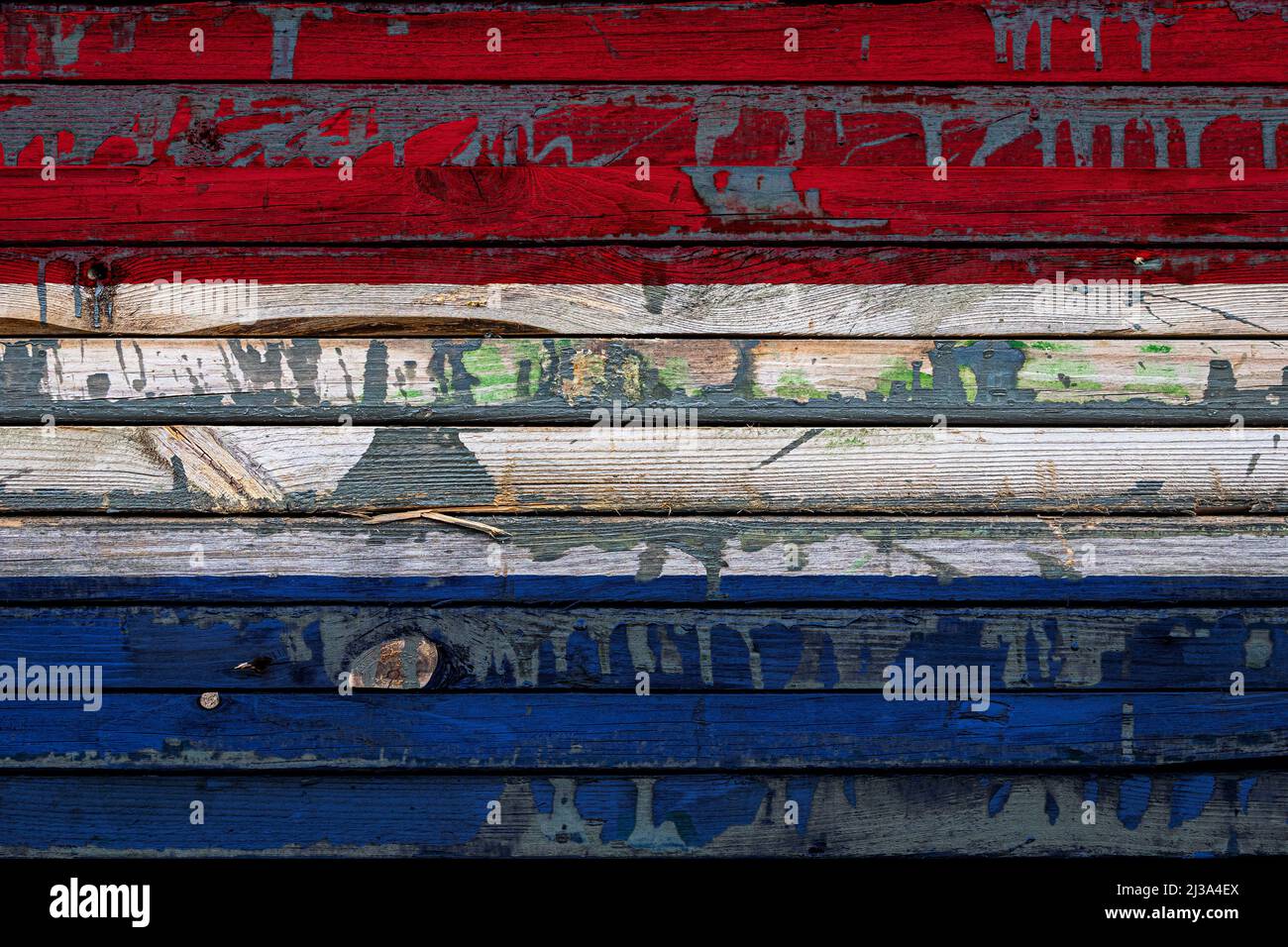The national flag of Netherlands is painted on uneven boards. Country ...