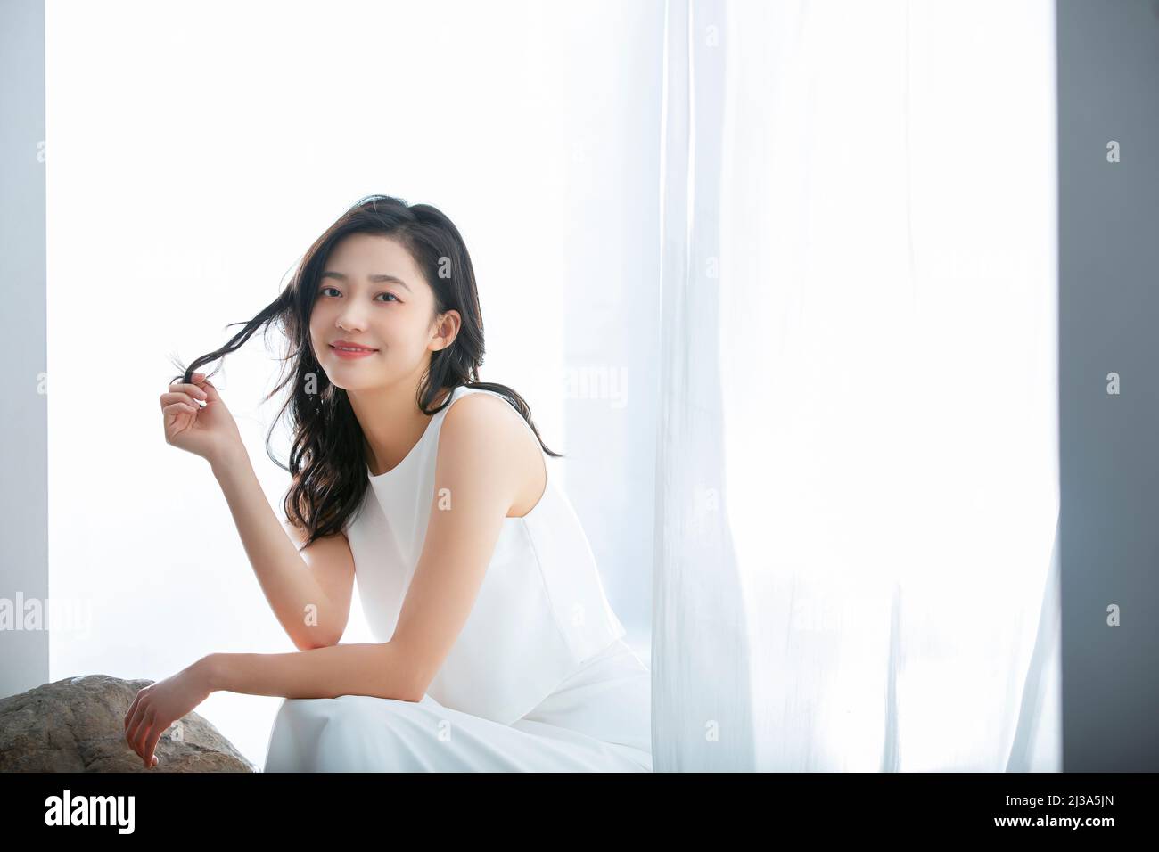 Fashionable Chinese lady with gorgeous clothes and elaborate makeup - stock photo Stock Photo