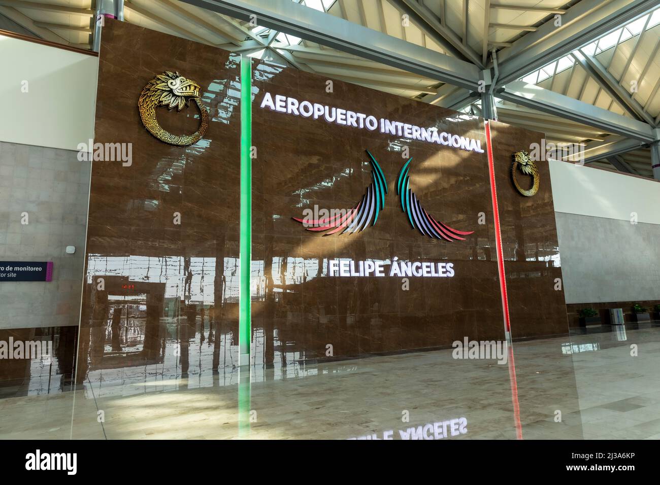 Interior of the Felipe Angeles International Airport. Departures lobby. Wall with letters signage and logo. Stock Photo