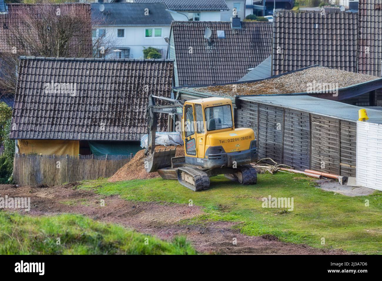 Marienheide, Germany - April 15, 2019: Volvo shovel excavators at a home construction site. Stock Photo