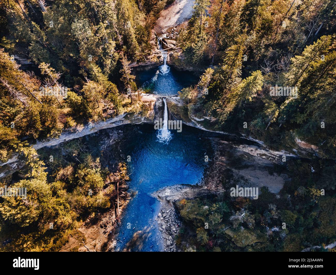 An aerial view of Buchenegger Wasserfalle, Buchenegger Waterfall on a sunny day in Oberstaufen, Germany Stock Photo