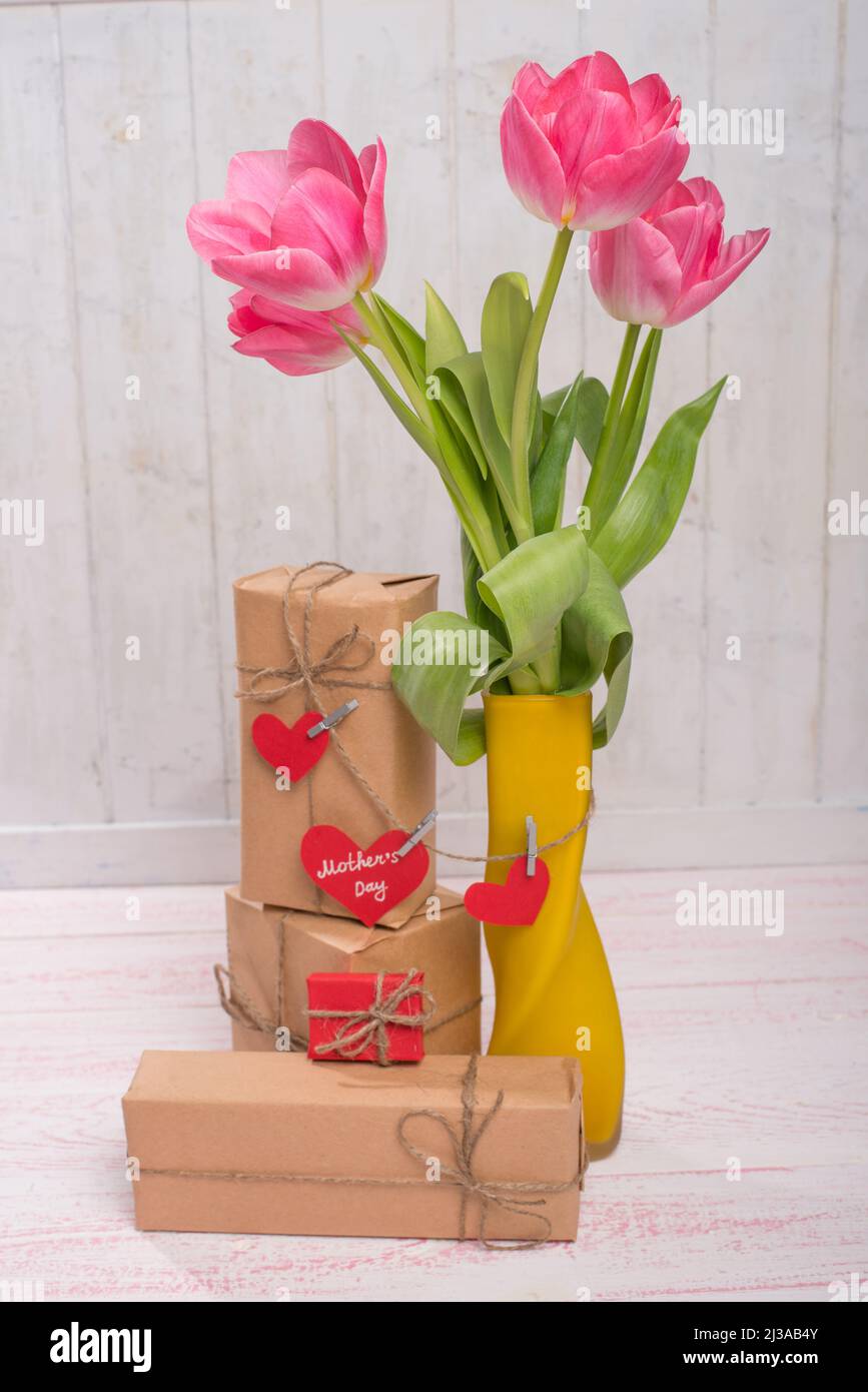 tulips and gifts on a paper texture Stock Photo Alamy