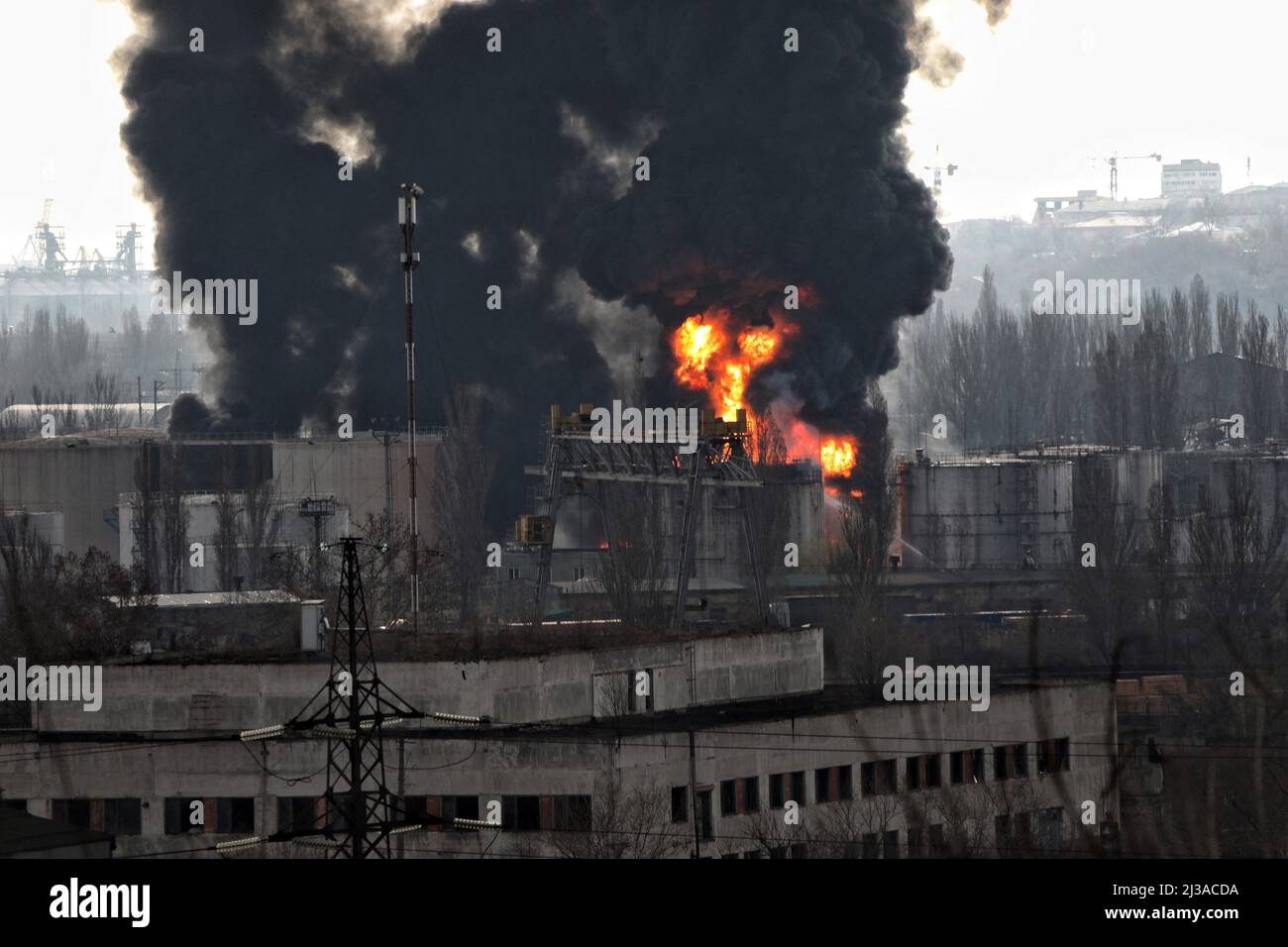A fire rages after Russian rockets hit an oil refinery and an oil depot
