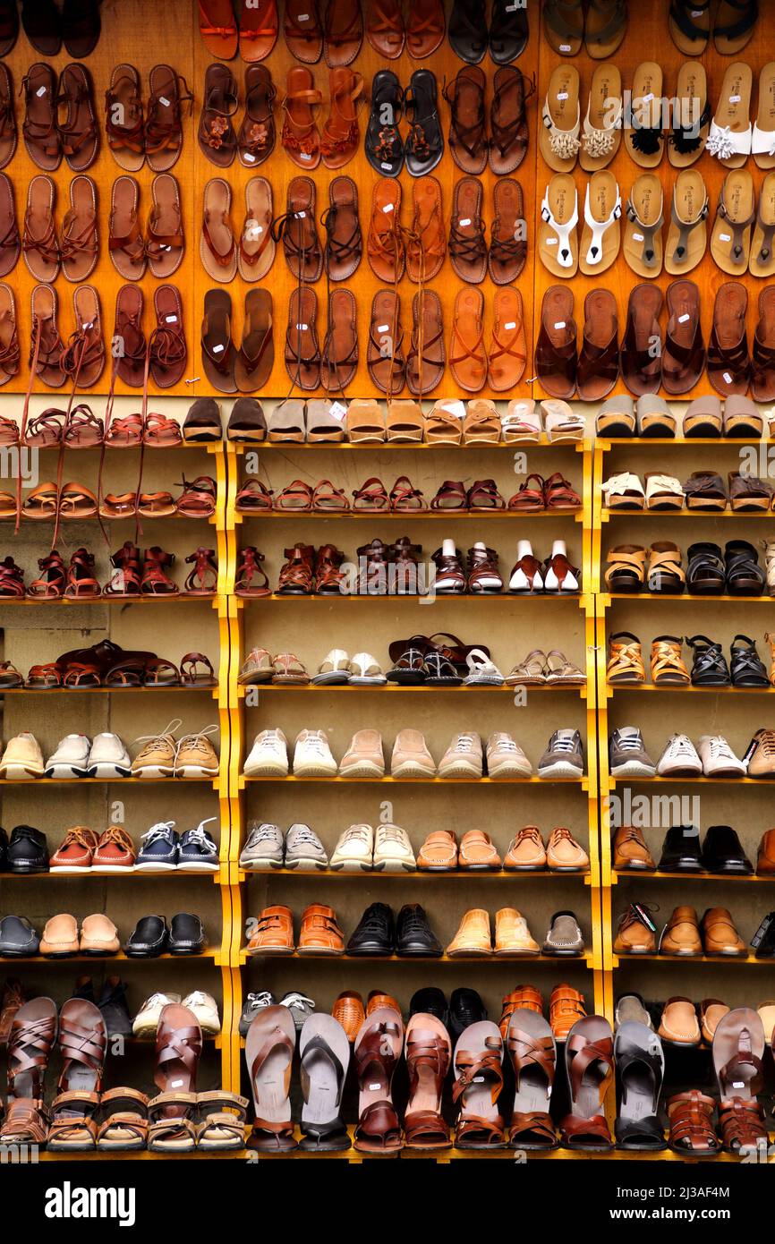 Shoes and sandals on display at a market in Florence Italy Stock Photo