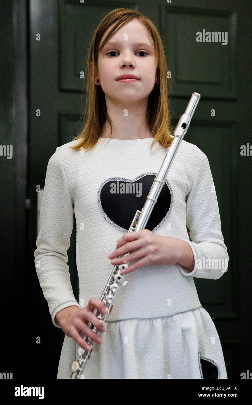 Berlin, Germany. 05th Apr, 2022. Anastasia Solovieva from Ukraine holds her flute before a benefit concert at the Carl Philipp Emanuel Bach Music High School in Berlin to support the Kruschelnitska Lyceum in Lviv, Ukraine. Eleven particularly gifted children from Ukraine go to school at the Berlin music high school and can continue their education there. Credit: Carsten Koall/dpa/Alamy Live News Stock Photo