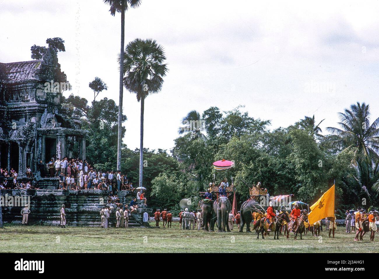 Costumed actors re-enact historic battles for a movie being directed by Prince Norodom Sihanouk, at Angkor Wat, Cambodia, 1966 Stock Photo