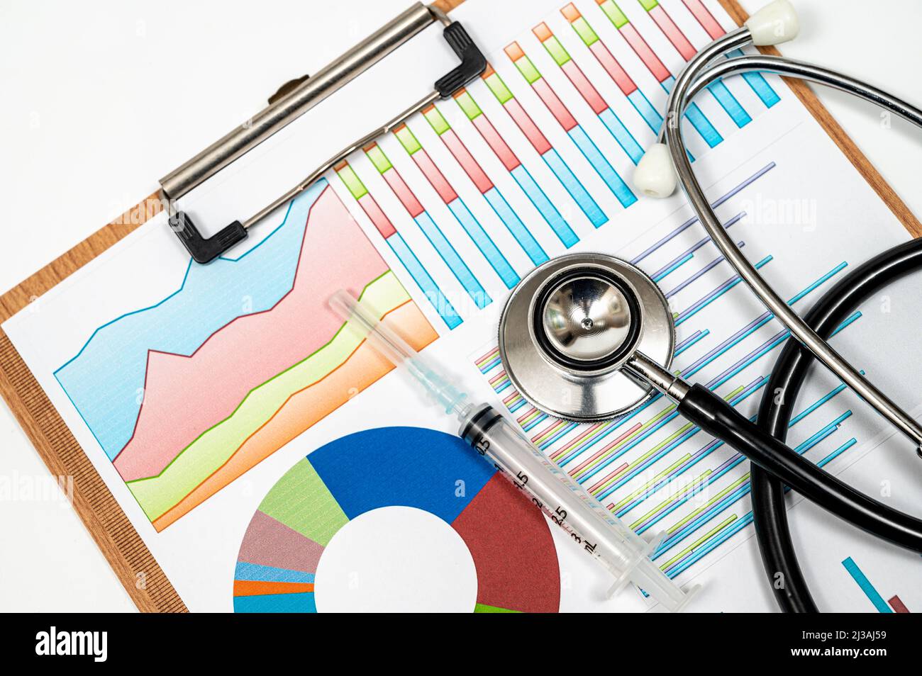 Medical concept background with several types of graphs and a stethoscope. Stock Photo