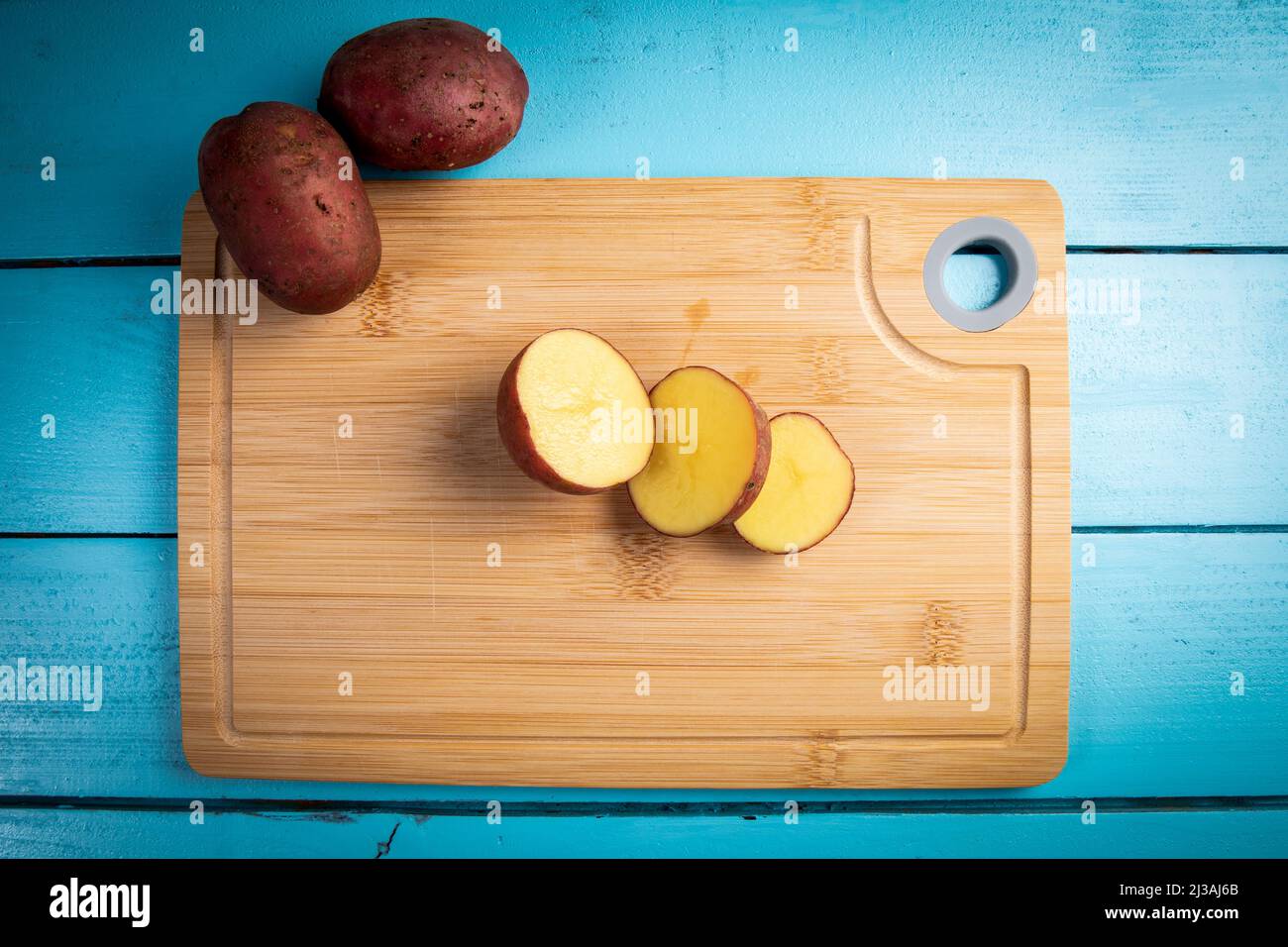 sliced-potatoes-on-a-bamboo-cutting-board-stock-photo-alamy