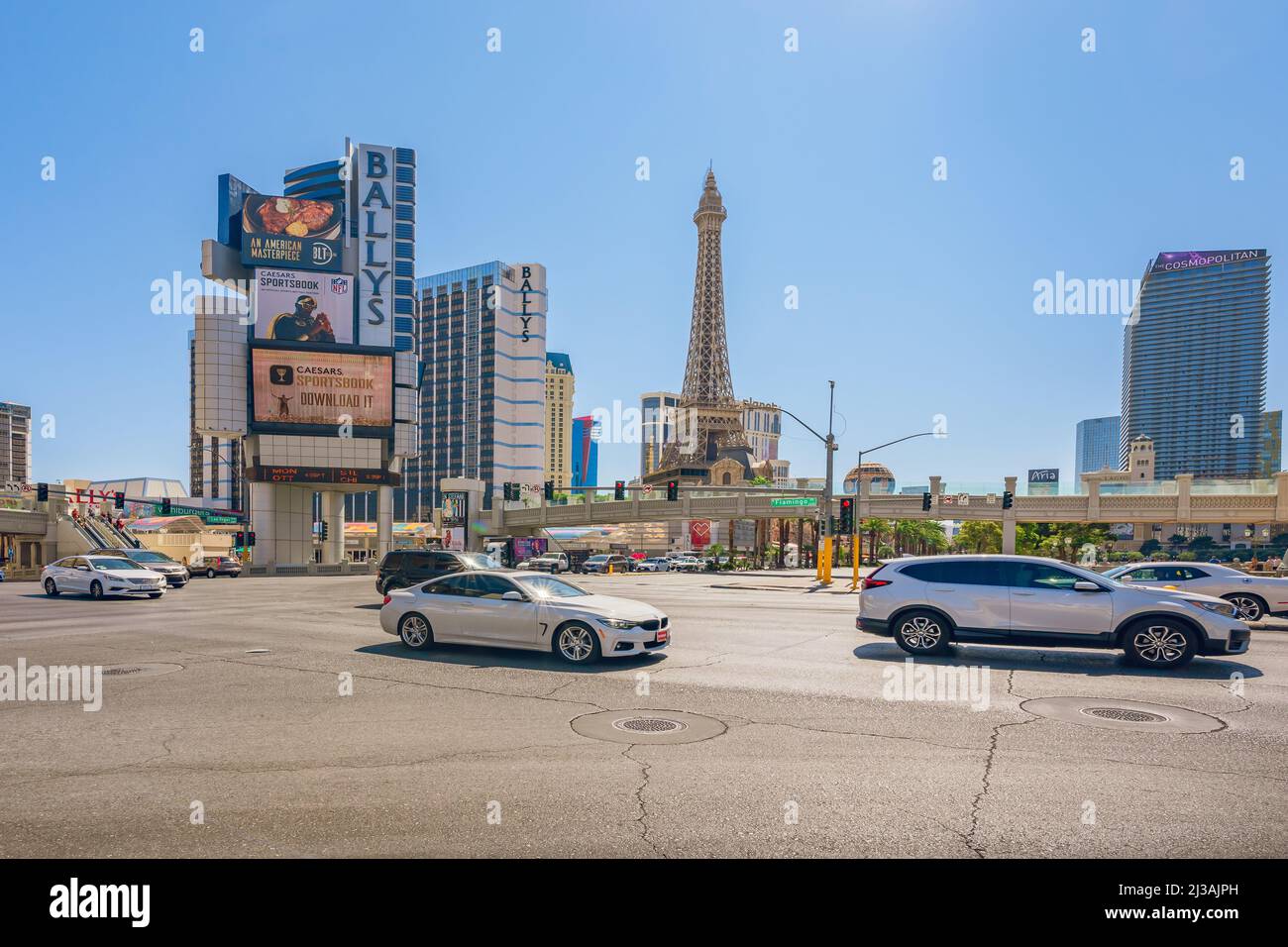 Las Vegas, Nevada, USA - October 1, 2021   Las Vegas Ballys Hotel, and Paris Hotel and Casino, street view, traffic, sunny day, clear blue sky backgro Stock Photo