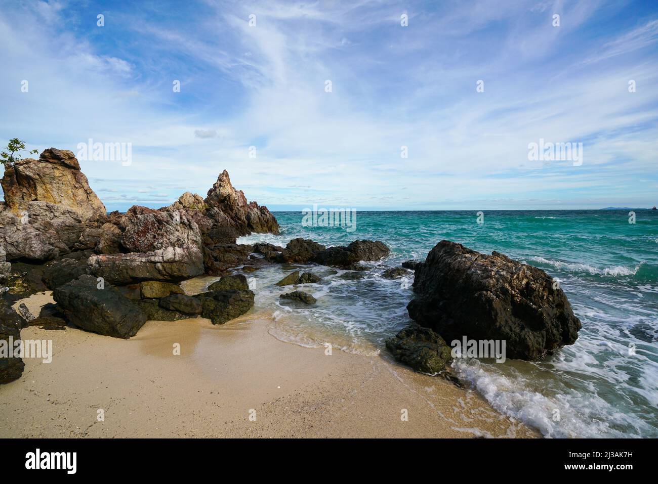 Sand beach among rocks, koh lan island thailand Stock Photo