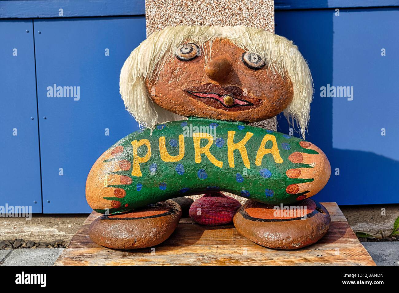 Colourful cairn, fantasy figure with the inscription Purka in front of a shop with handicrafts, souvenirs, Flateyri, Isafjaroarbaer, Vestfiroir Stock Photo