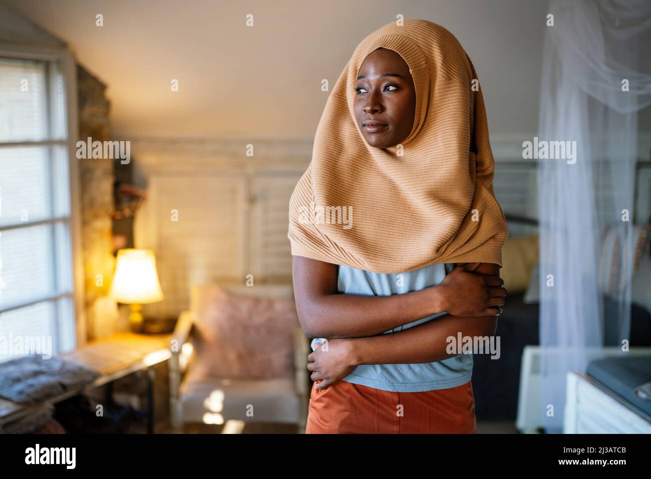 Portrait of beautiful young black african muslim woman wearing headscarf Stock Photo