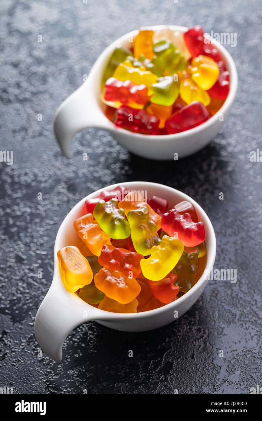 Jelly gummy bears candy. Colorful sweet confectionery in bowl. Stock Photo