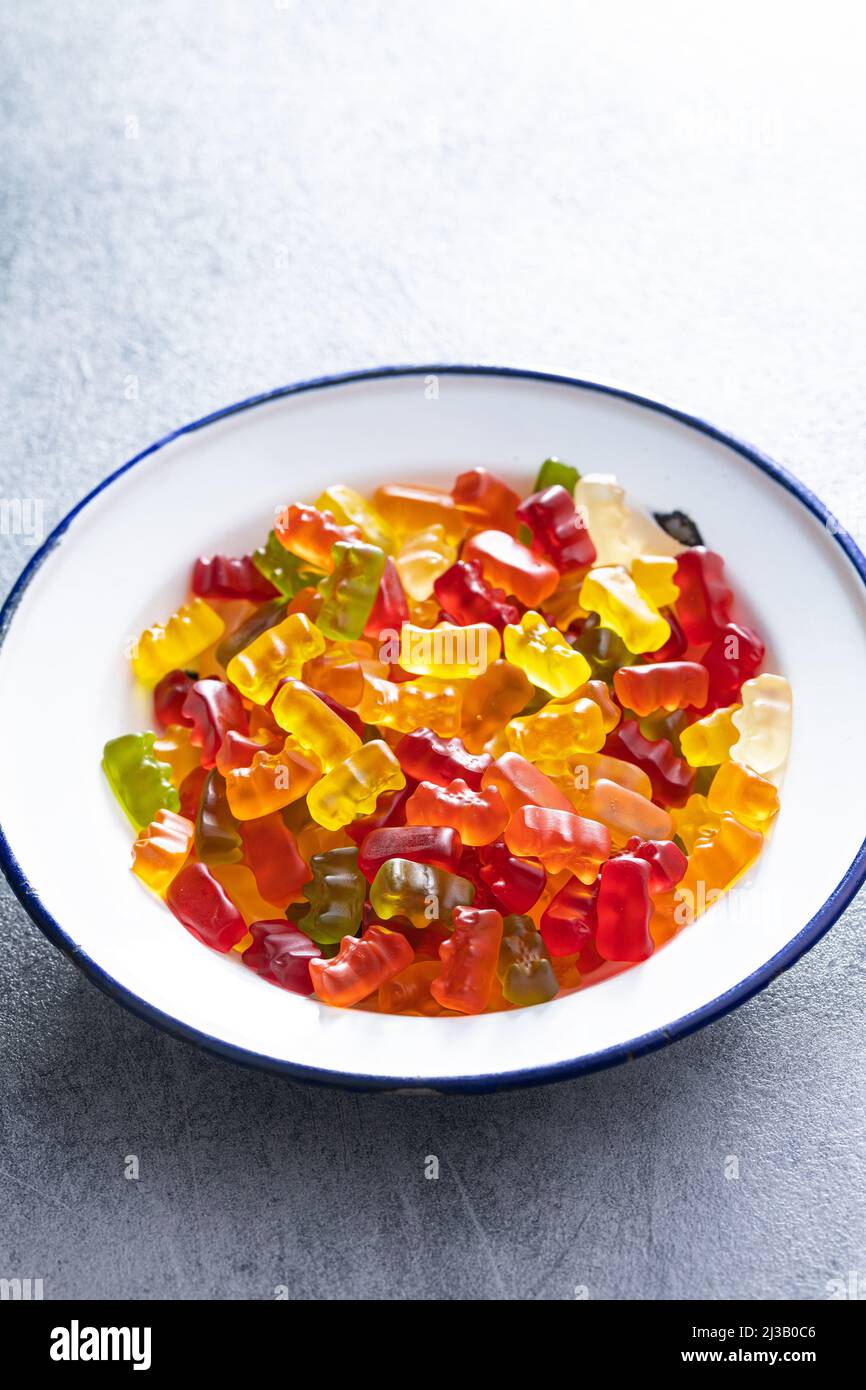 Jelly gummy bears candy. Colorful sweet confectionery in plate. Stock Photo