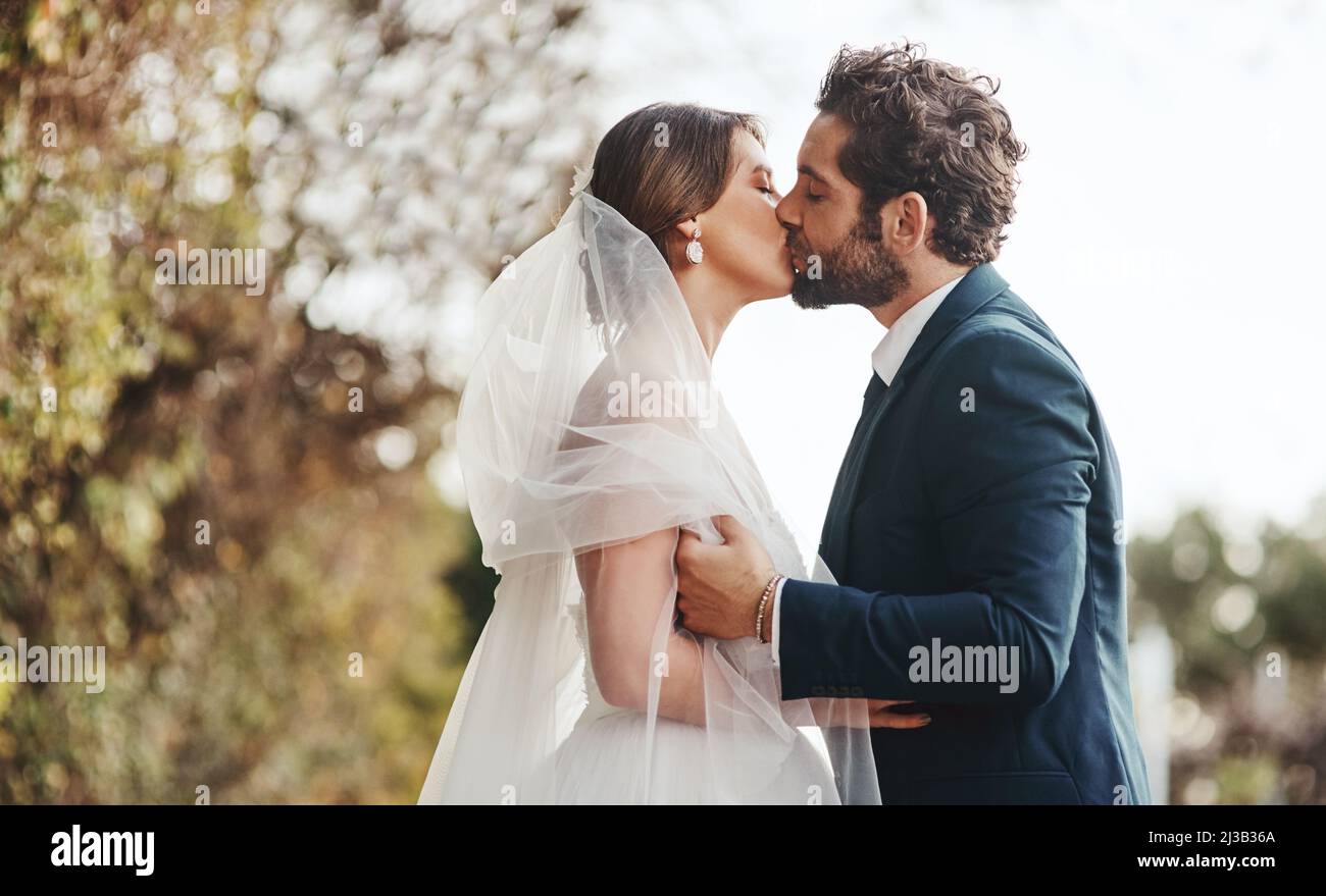 We have the most beautiful love story. Shot of a young couple kissing