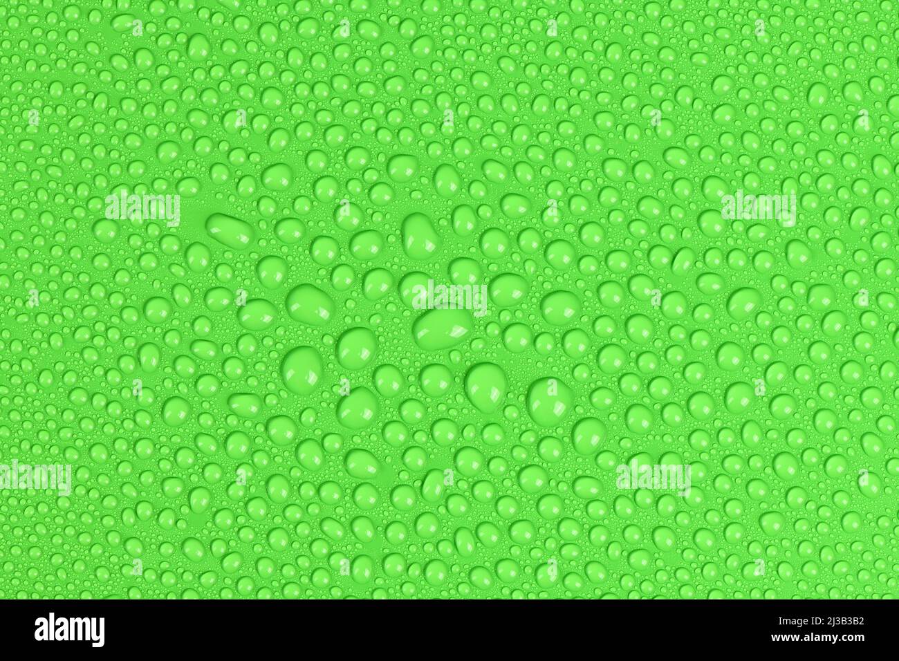 Abstract texture of water drop background. Droplet on green background. High resolution photo. Full depth of field. Stock Photo
