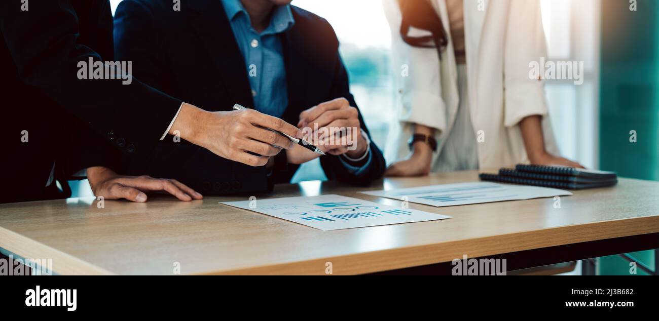 Cropped shot of diverse coworkers working together in boardroom, brainstorming, discussing and analyzing business strategy Stock Photo