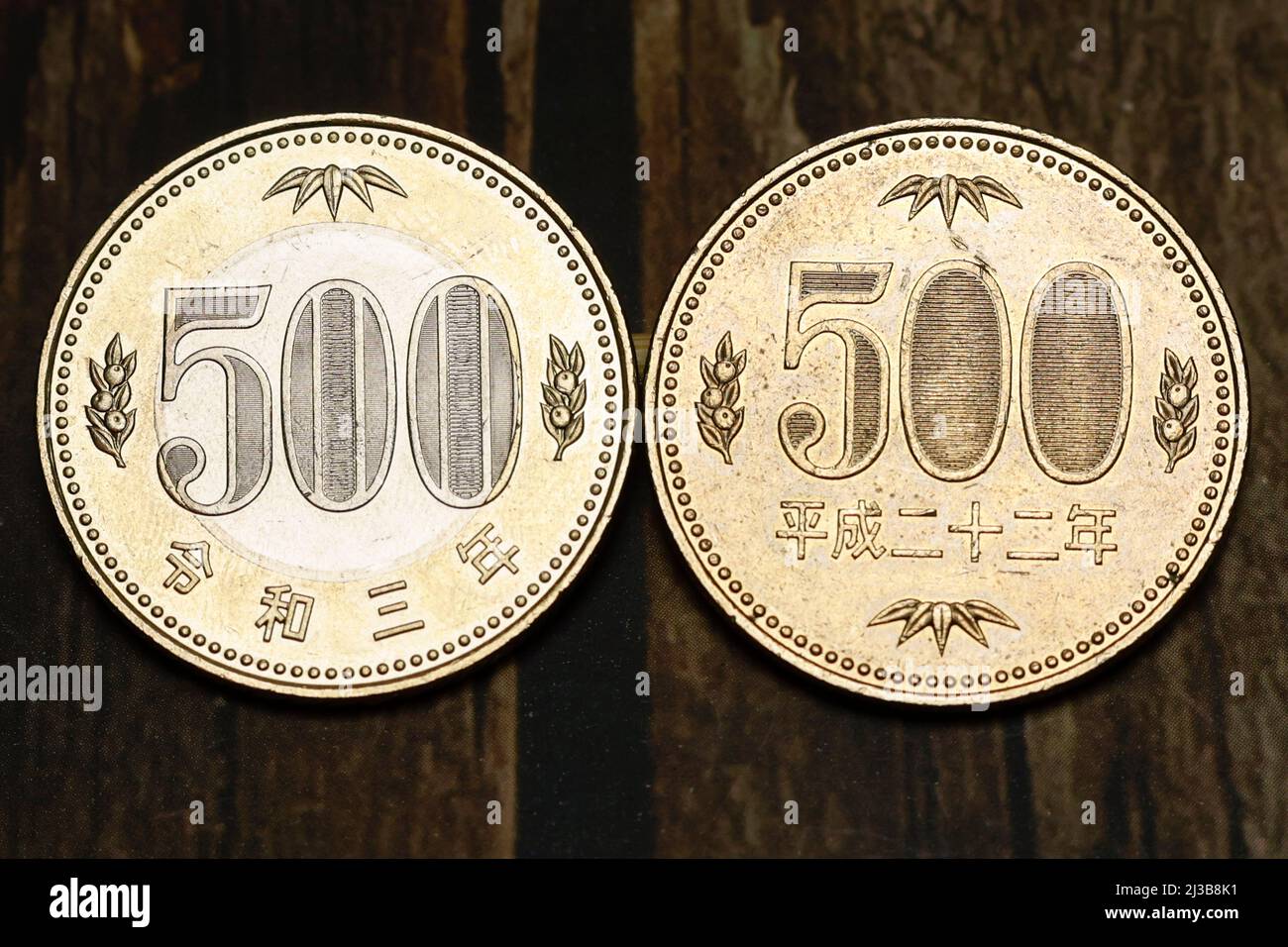 (L to R) Samples of the new and old versions of the Japanese 500 yen coins are photographed on April 7, 2022, in Tokyo, Japan. The latest version coin in two-tone was issued in the first half of fiscal 2021 to commemorate the 150th anniversary of the modern currency system. Credit: Rodrigo Reyes Marin/AFLO/Alamy Live News Stock Photo
