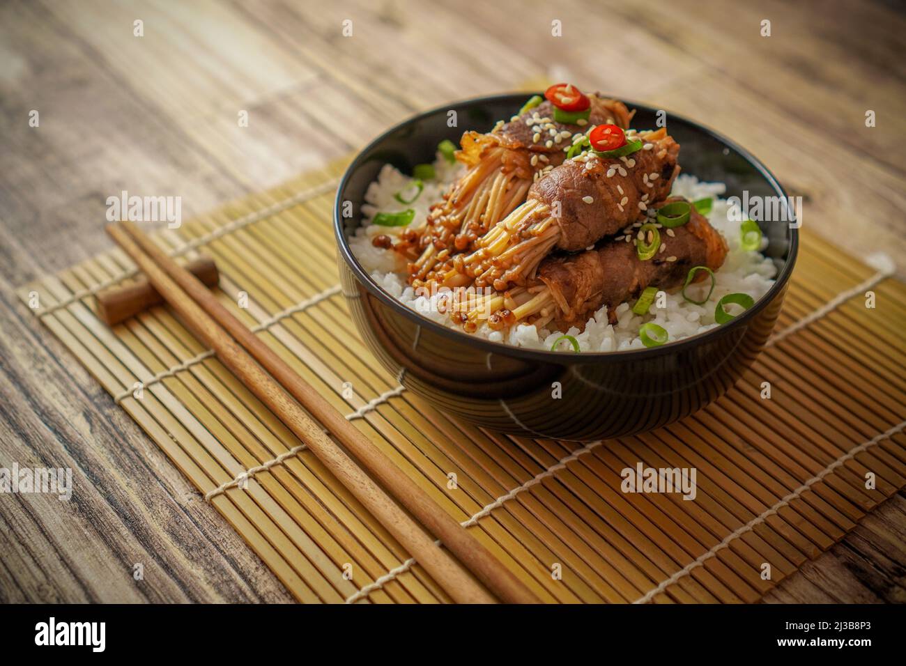 Japanese Teriyaki Beef Enoki Rice Bowl Stock Photo