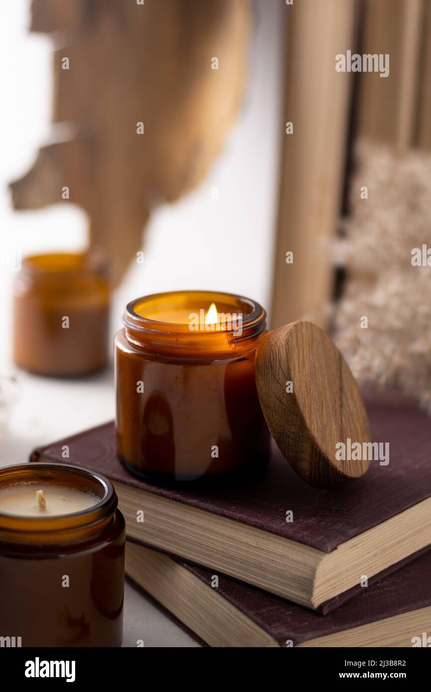 A set of different aroma candles in brown glass jars. Scented handmade