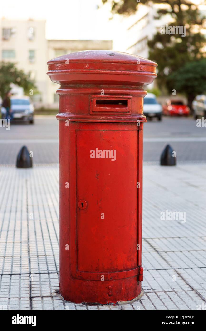 close-up photograph of vintage red mailbox in the street Stock Photo