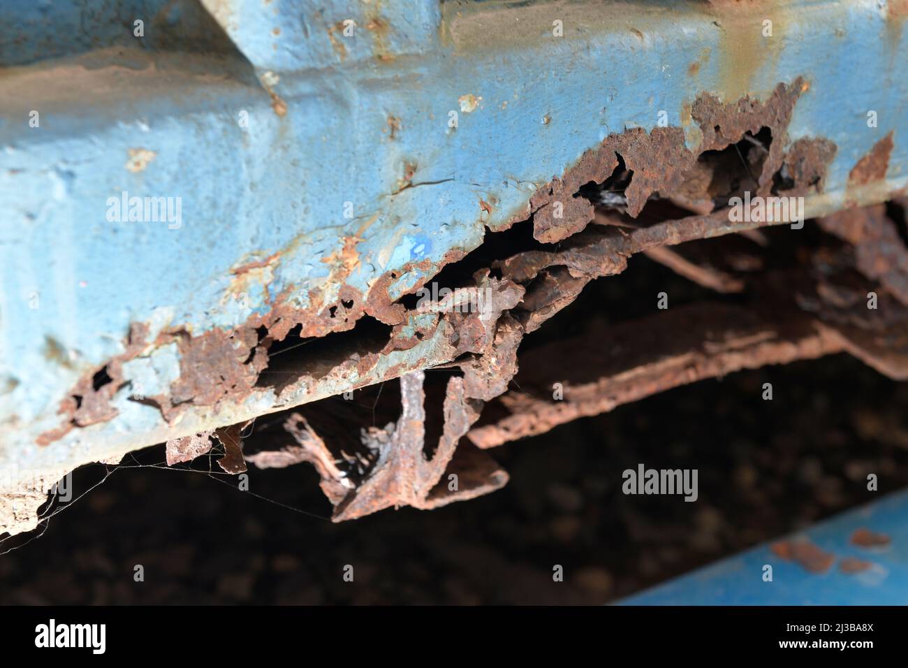 rusting bottom rails of shipping container Stock Photo