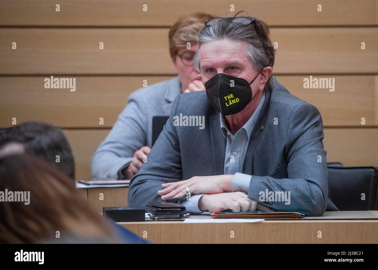 Stuttgart, Germany. 07th Apr, 2022. Manfred Lucha (Bündnis 90/Die Grünen), Minister of Health of Baden-Württemberg, sits in his seat during a state parliament session in the plenary hall. One of the issues at stake during the state parliament session is the vote on a motion to dismiss Health Minister Lucha (Bündnis 90/Die Grünen), submitted by the FDP and SPD. Credit: Christoph Schmidt/dpa/Alamy Live News Stock Photo