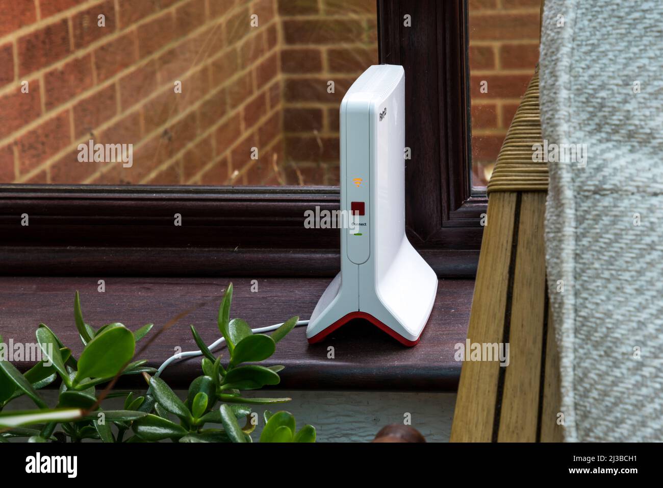 An AVM FRITZ! Repeater 3000 network repeater used to extend a home wi-fi signal out to a conservatory. Stock Photo