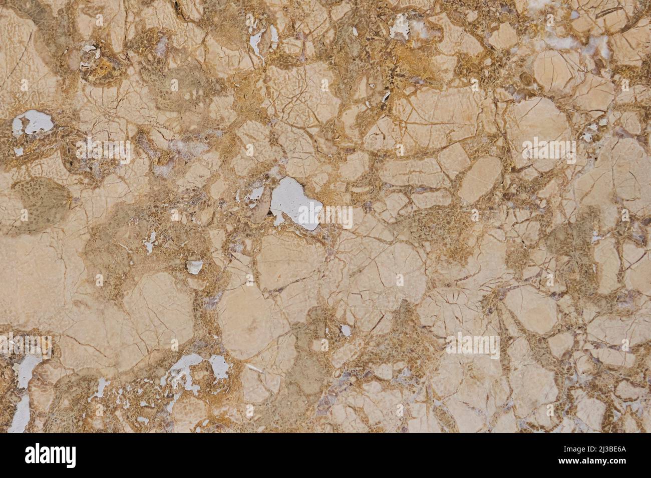 Peeling veined brown stone wall. Natural weathered pattern. Abstract background Stock Photo