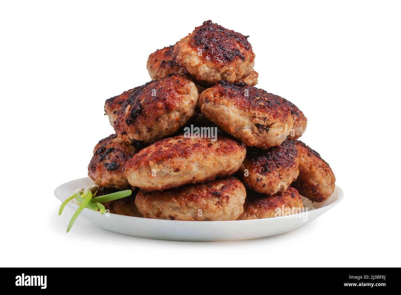 Fried meat cutlets in a slide on a dish isolated on a white background ...