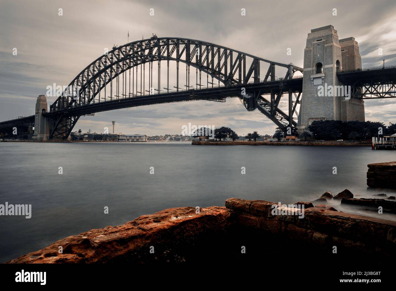 Iconic Sydney Harbour Bridge on a moody day. Stock Photo