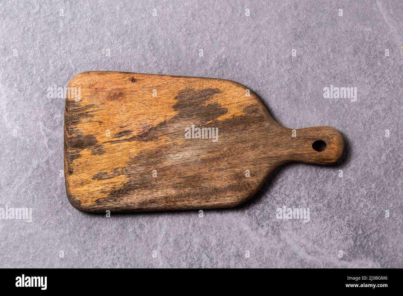 Cutting board on gray background Stock Photo