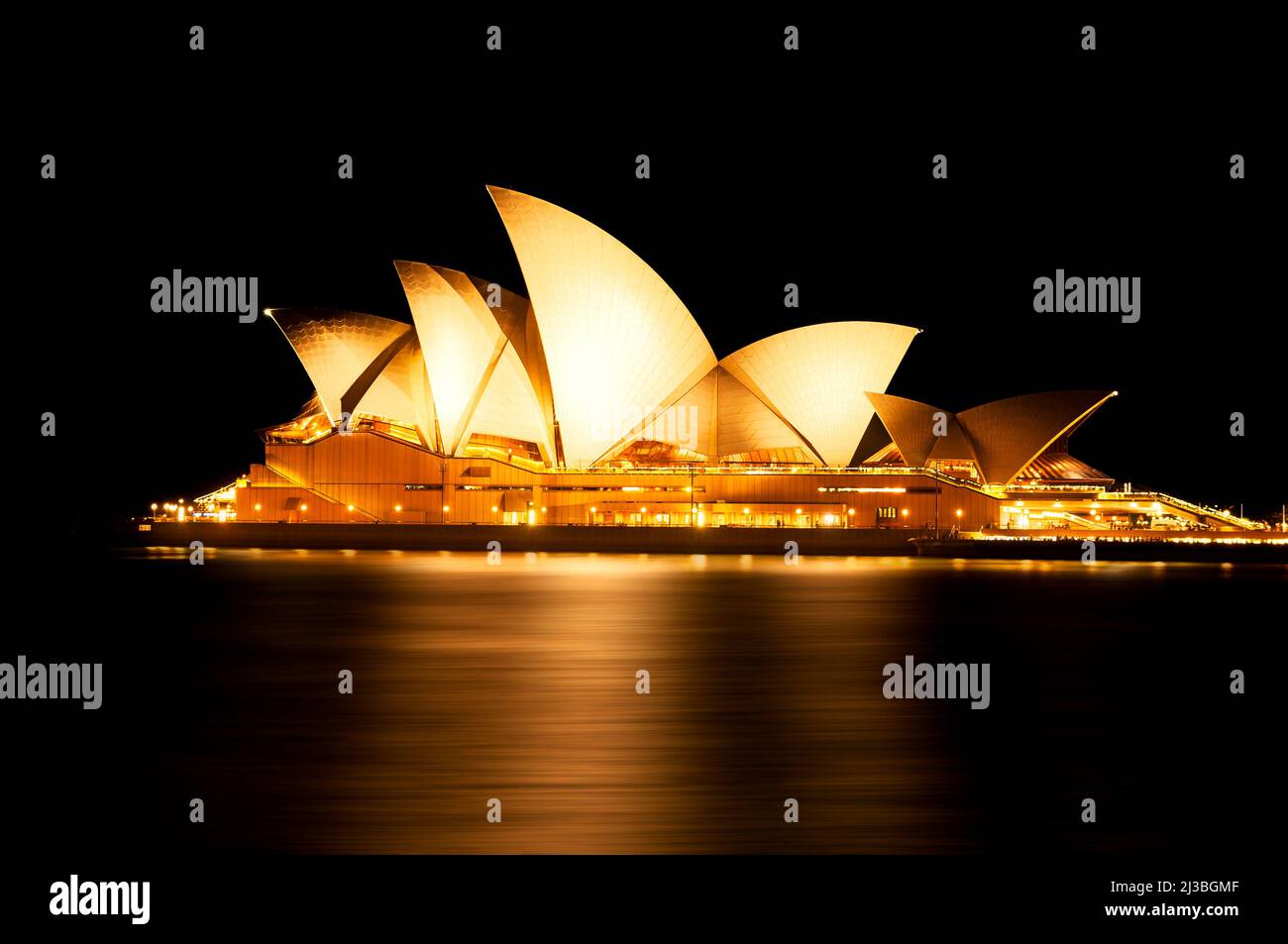 Iconic Sydney Opera House at night. Stock Photo