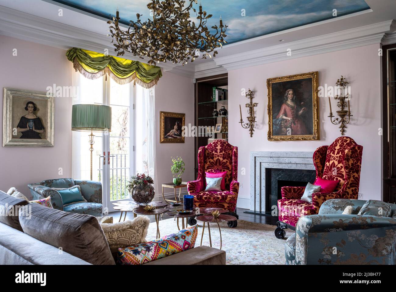 William and Mary–style armchairs upholstered in velvet under trompe l’œil sky by Timna Woollard in Holland Park home, London, UK Stock Photo