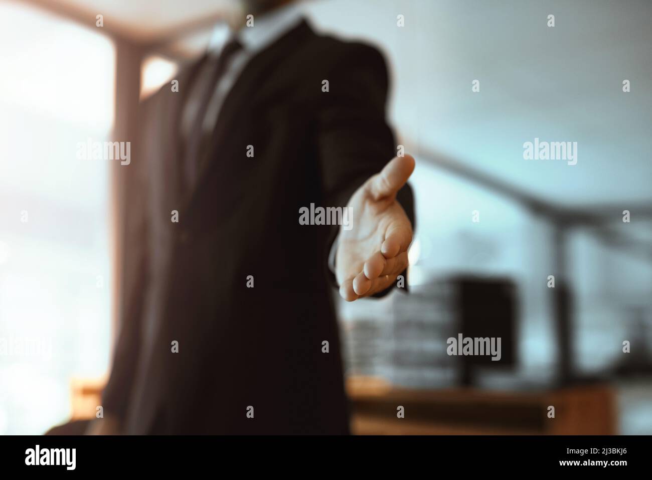Id like to have you as my business partner. Closeup shot of an unrecognizable businessman extending a handshake in an office. Stock Photo
