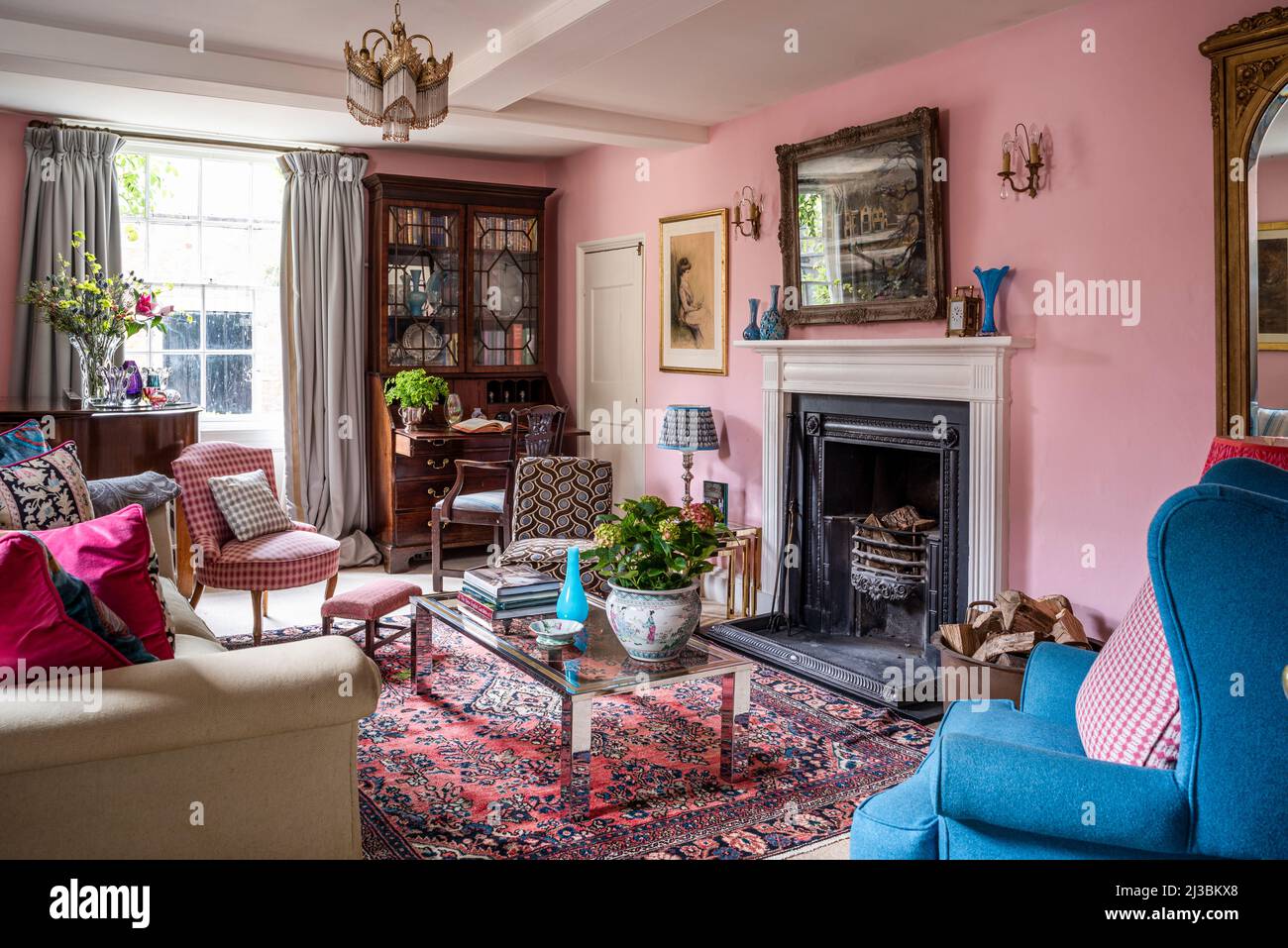 Pink drawing room with furnishings and upholstery in assorted fabrics