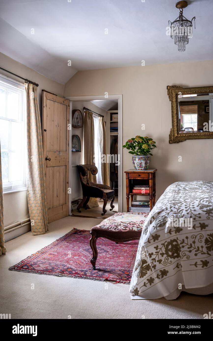 Antique furniture with gold embroidered bedspread in 17th century