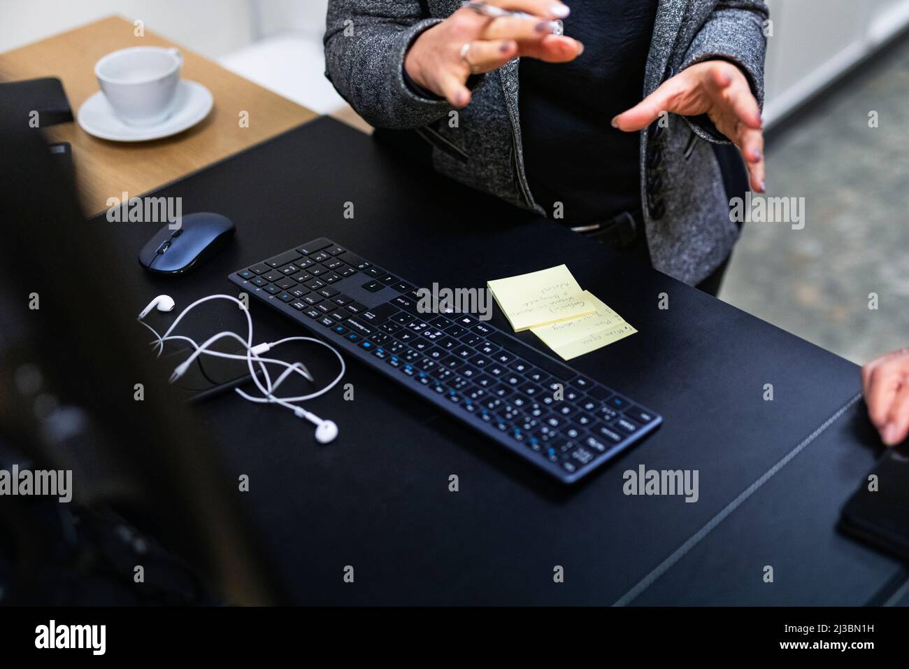 Computer keyboard, mouse, and headphones on desk Stock Photo