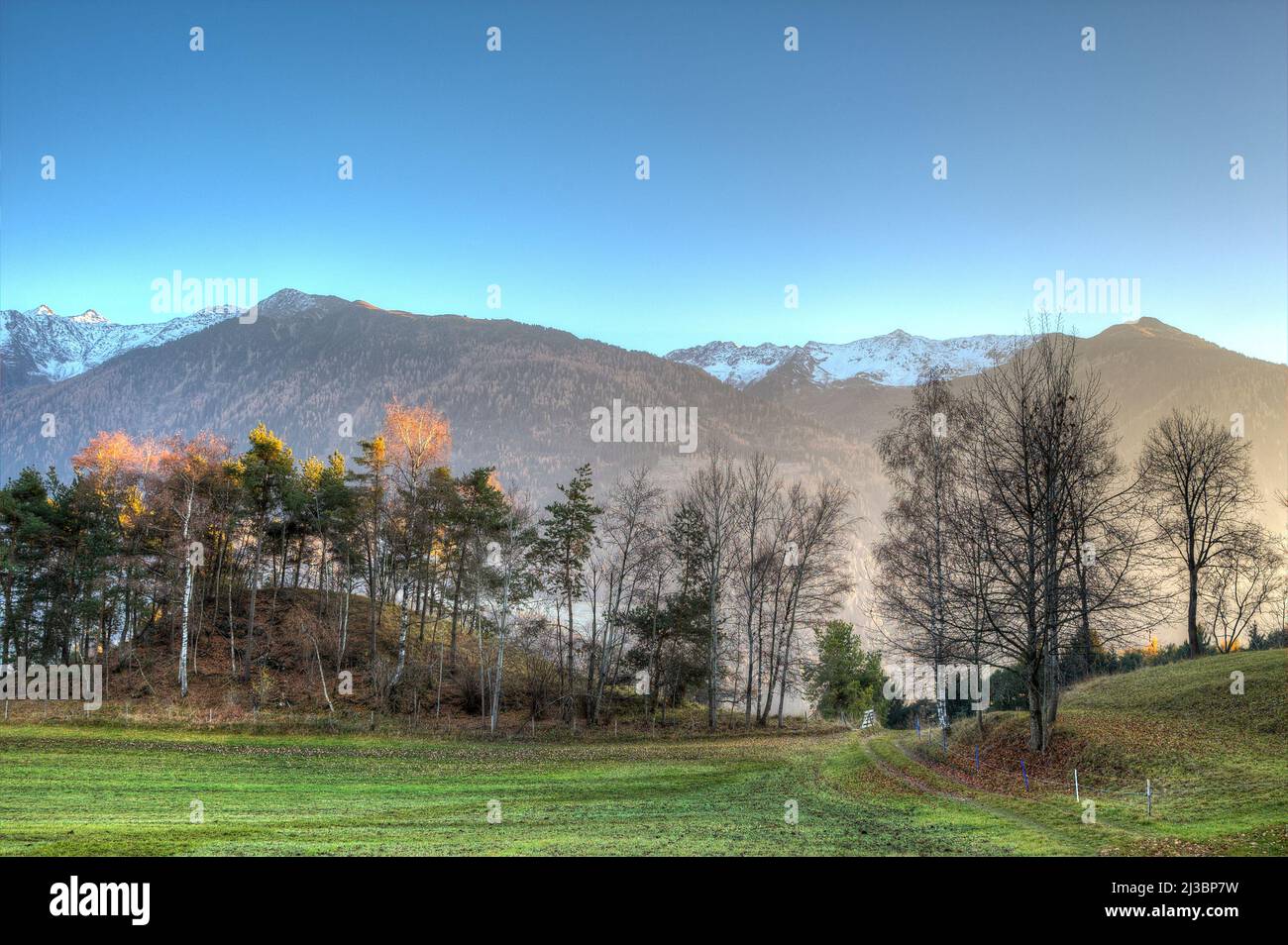 Wonderful view over the Tyrolean mountains in the light of the setting sun. Stock Photo