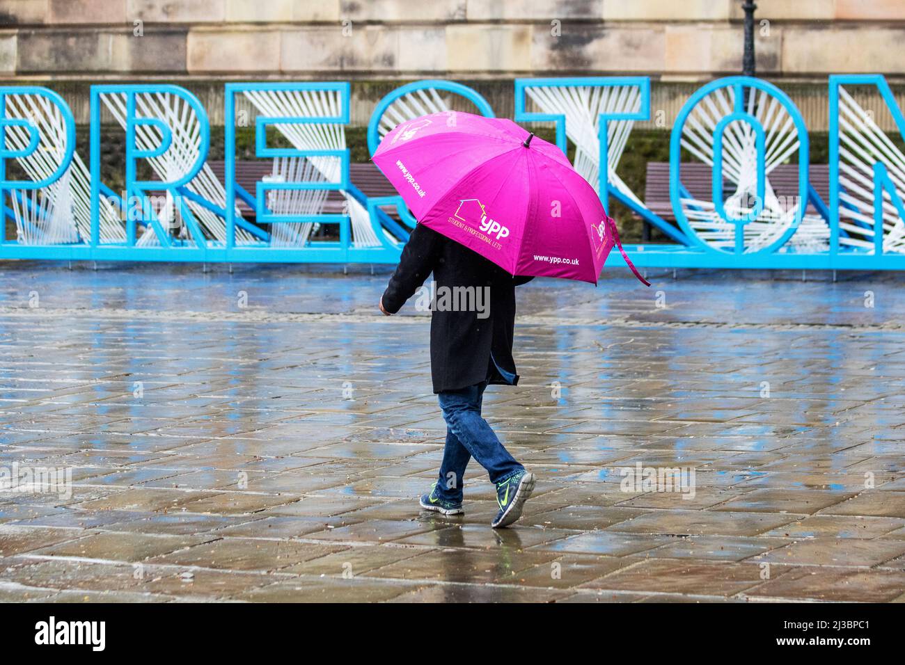 Preston, Lancashire.  UK Weather 07 April, 2022.  Strong winds and heavy downpours in Preston as temperatures drop to 7c. Shoppers getting drenched as driving rain and gale force winds dampen high street spirits.  Very windy with April showers throughout the day.  Credit: MediaWorldImages/AlamyLiveNews Stock Photo