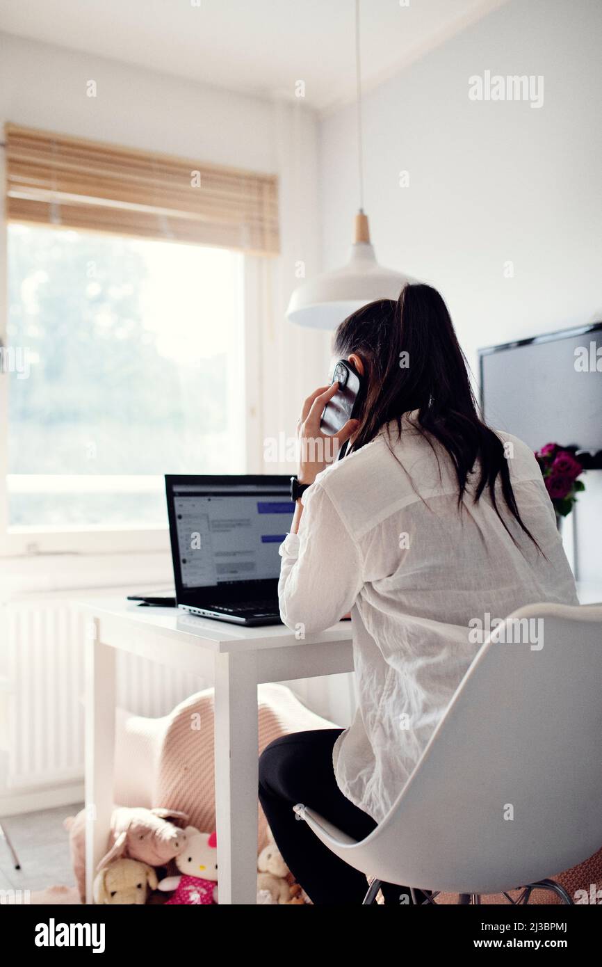 Woman using cell phone Stock Photo