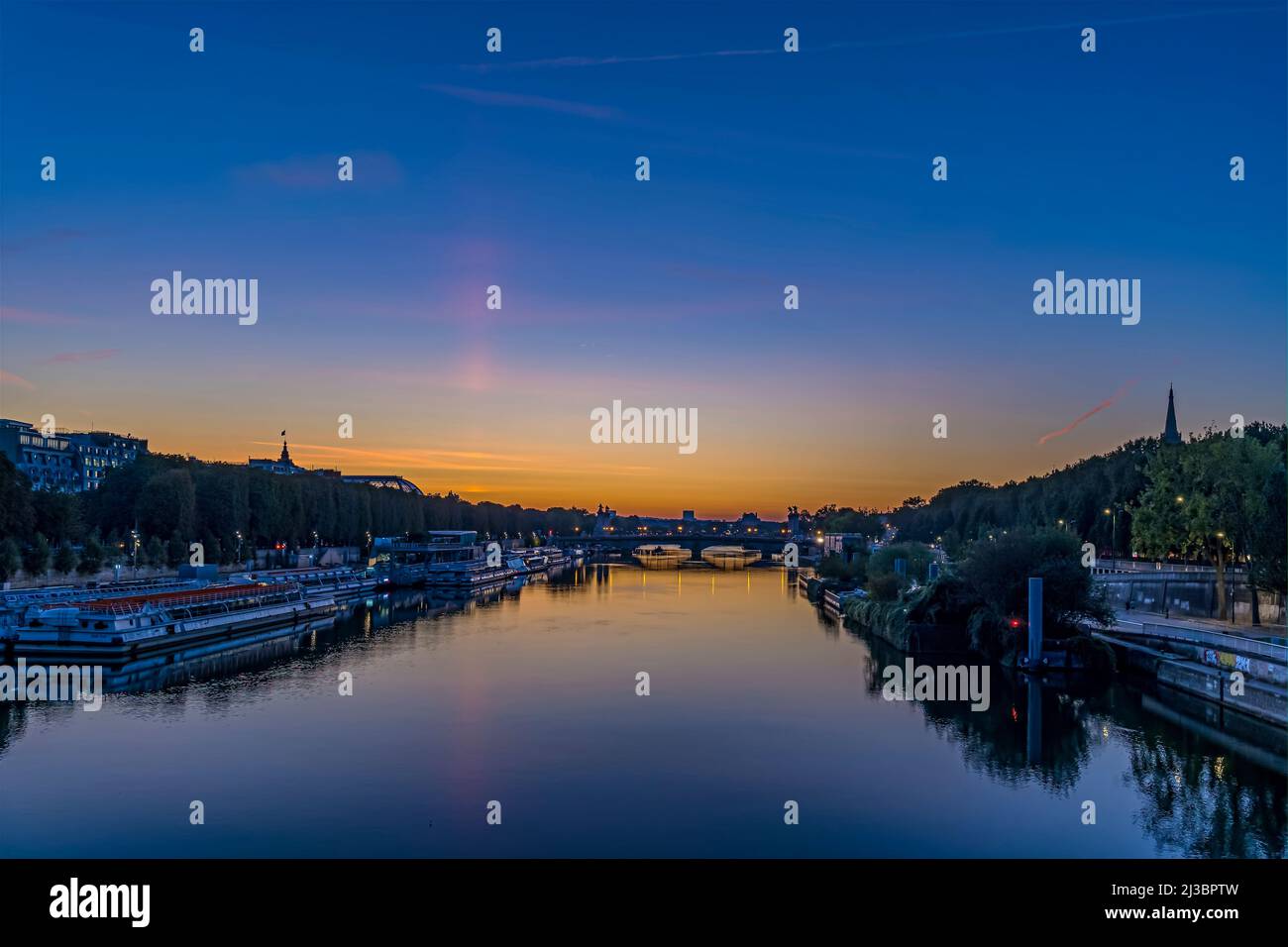 Twilight in Paris Touristic Center From Seine River With Buildings